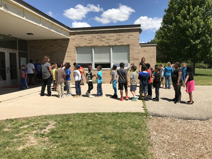 Students line up outside Harrington Elementary.