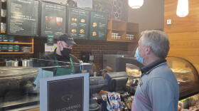 Michael Moros, Indianapolis Marriott Downtown general manager, gets a coffee from the hotel's Starbucks.