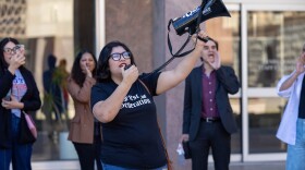 Woman holds megaphone