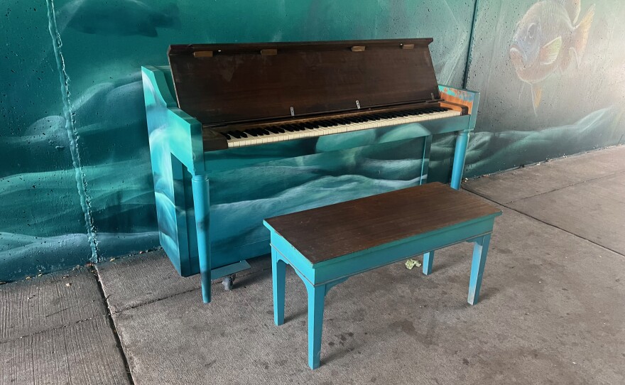 Burdick painted the piano in the tunnel to blend in with the mural. While Burdick's work was invited, the piano mysteriously appeared in the tunnel back in May of 2023 and was kept in place after some conversation among city officials. (Photos: Michael Livingston/IPR News)