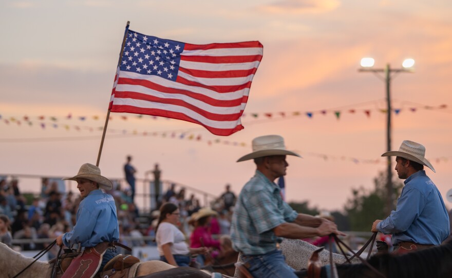 The American flag leads the Grand Entry to kick off the Wolfe City Rodeo on Friday, Aug. 7, 2026, in Wolfe City, Texas.
