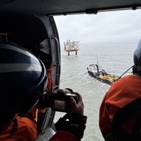 U.S. Coast Guard personnel conduct an aerial survey of the North Trading Bay sheen location and the inactive Spark platform on Wednesday, Aug. 26, 2026 in Cook Inlet, Alaska.
