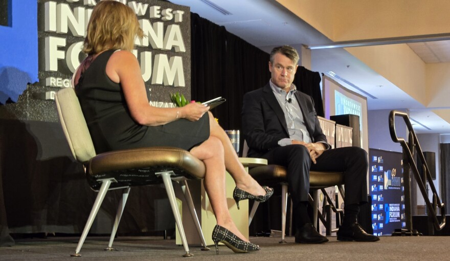 U.S. Sen. Todd Young (right) speaks to Heather Ennis, president & CEO of the Northwest Indiana Forum, during its Ignite the Region luncheon in Merrillville on Aug. 20.