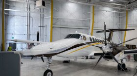 The University of Wyoming’s King Air research aircraft sits in a hangar at the Salt Lake City International Airport, Aug. 3, 2026. The plane must be constantly hooked up to air conditioning when not in flight to keep sensitive instruments and computers cool enough to operate properly.