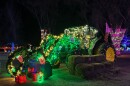 Green tractor wrapped in lights at Washington Park 