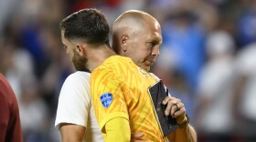 Coach Gregg Berhalter of the United States greets goalkeeper Matt Turner after losing 0-1 against Uruguay at the end of a Copa America Group C soccer match in Kansas City, Mo., Monday, July 1, 2024. (AP Photo/Reed Hoffman)