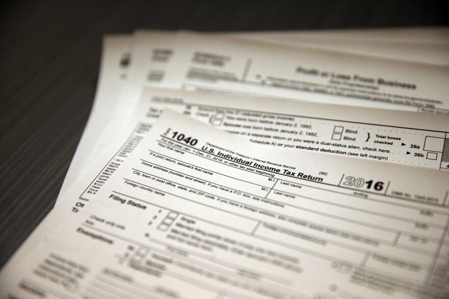 In this Jan. 14, 2017, photo, tax forms sit on a desk at the start of the tax season rush, inside the offices of tax preparation firm Infinite Tax Solutions, in Boulder, Colo. (Brennan Linsley/AP)