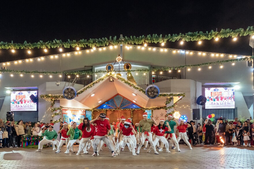 A youth group performs in the courtyard.