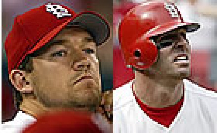 Scott Rolen (l) and Jim Edmonds (r) both picked up their fifth straight Gold Glove awards. (UPI photos)