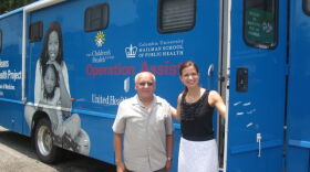 Carlos Naranjo and Dr. Alina Olteanu of the New Orleans Children's Health Project at their mobile clinic -- a pediatrics office on wheels.