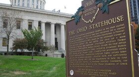Ohio Statehouse in background with Historical Marker Plaque in the foreground