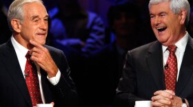 Republican presidential candidates Ron Paul and Newt Gingrich laugh at a presidential debate at Dartmouth College in Hanover, N.H., in October. 