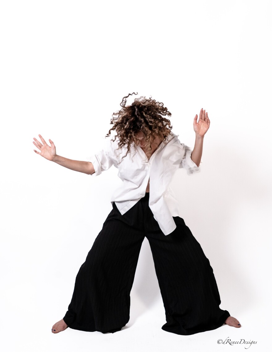 Frida Mann dances against a white back drop