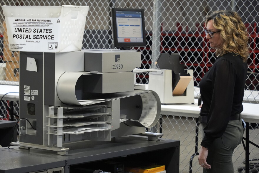 An Allegheny County Election worker demonstrates a machine used to count mail-in ballots at the elections warehouse in Pittsburgh, on April 18, 2024. Pennsylvania is seeing lots of action targeting gaps in its vote-by-mail laws. The problem is that it's in the courtroom and not the Legislature.<br>