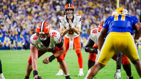 Syracuse quarterback Steve Angeli (9, White) takes a snap against Pittsburgh