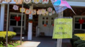 A sign posted near the entrance to the Kimberly Hall South nursing home shows the home closed to visitors, Thursday, May 14 in Windsor, Conn. The coronavirus has had no regard for health care quality or ratings as it has swept through nursing homes around the world, killing efficiently even in highly rated care centers.