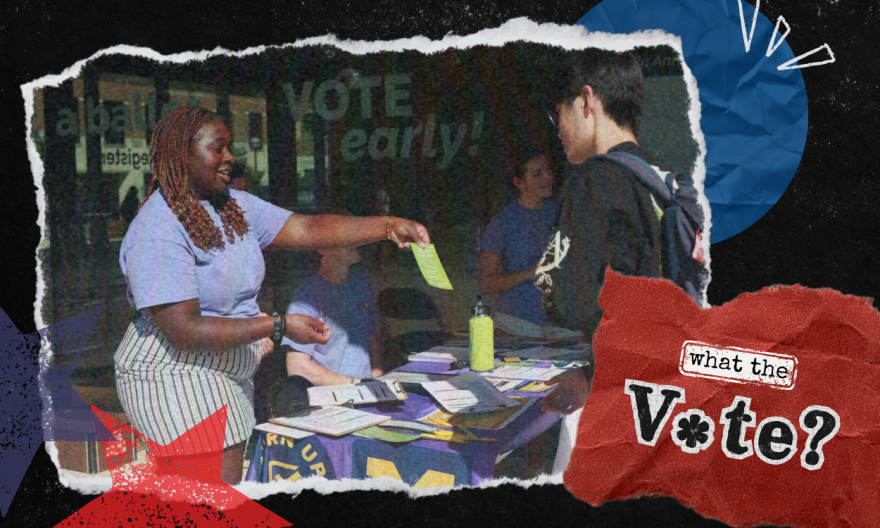 A female student hands a male student a green information card over a table for the organization "Turn Up Turnout"