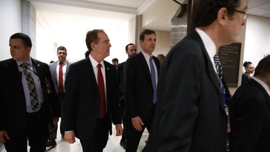 Pictured: House Democratic impeachment manager Rep. Adam Schiff (second from left) leaves a news conference on Capitol Hill on Tuesday