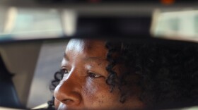 Jaquelyn “Jackie” King, a rideshare driver for the company Uber, waits for rider Jimmy Rochelle in Gainesville, Fla., on Thursday, Nov. 20, 2025. Rochelle was using the rideshare service to get home from the UF Shands Hospital.