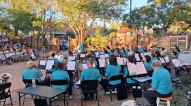 Karen Steele introduces the Four Corners Community Band during the world premiere of Jadon Cruzan's Cortez Overture on Aug. 15 at the Cortez Cultural Center. The piece was written in celebration of Cortez’s 140th anniversary. Photo by LP McKay/KSJD