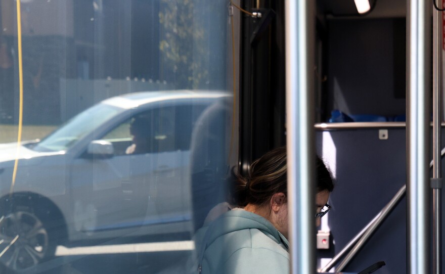 A Santa Fe College students rides RTS route 76, driven by in Gainesville, Fla. on Thursday, Nov. 13, 2025.