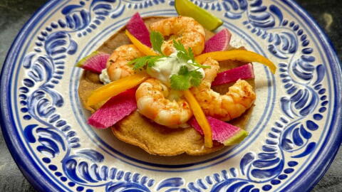 Shrimp tostadas with lime-cilantro cream, radishes, and peppers. (Kathy Gunst/Here & Now)