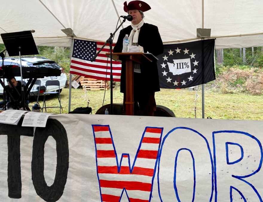 A man in Revolutionary War-era costume speaks to the crowd at the Freedom To Worship Protest in Whidbey Island, WA, on October 18, 2020. 