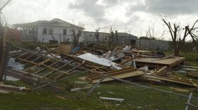 In this Thursday, Sept. 7, 2017, photo, damage is left after Hurricane Irma hit Barbuda. Hurricane Irma battered the Turks and Caicos Islands early Friday as the fearsome Category 5 storm continued a rampage through the Caribbean that has killed a number of people, with Florida in its sights. (Anika E. Kentish/AP)