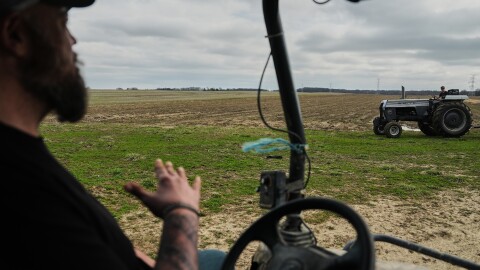 Wayne Greier, left, talks with his son, Blake, 13, right, as they move farm equipment Tuesday, March 10, 2026, in Canfield, Ohio.