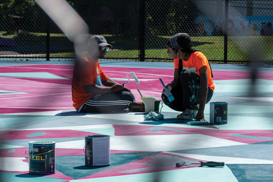 Marcus Austin and Paris Cockrell paint and chat on the last day of the 2021 Peculiar Asphalt season.