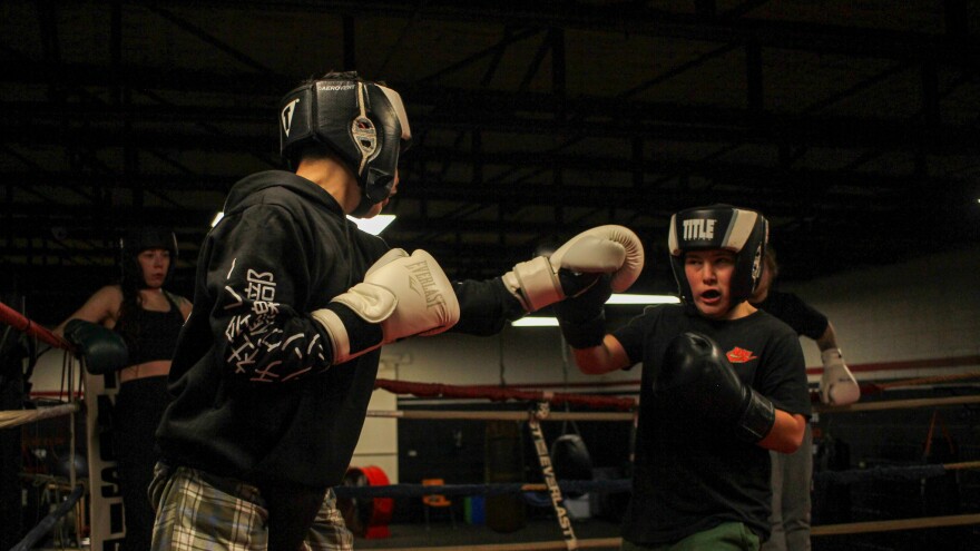 Lynix Lemtz, 13, left, spars with Chris Dennis, 11, during an evening practice at the Zanesville PAL boxing gym.