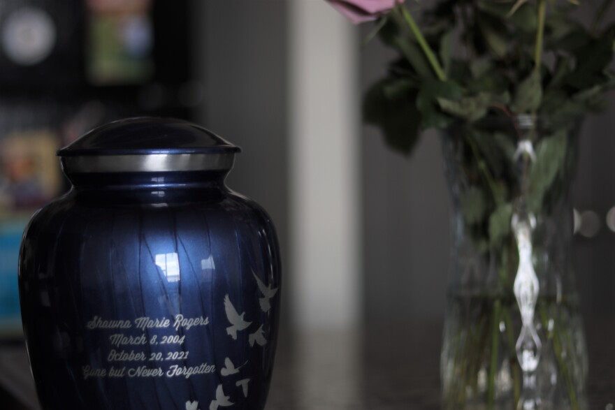 An urn with the remains of Shawna Rogers sits in her grandmothers front room.