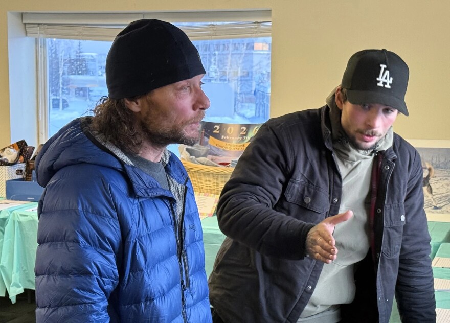 Jason Mackey, left, and his son Patrick Mackey, right, recount their experiences on the trail. The younger Mackey took home this year’s Red Lantern.