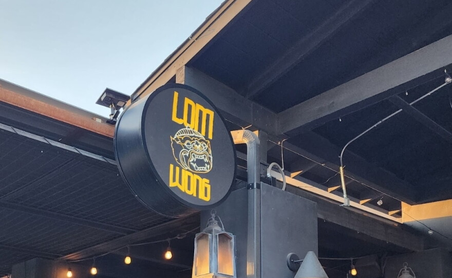 yellow and black Lom Wong sign in downtown Phoenix.