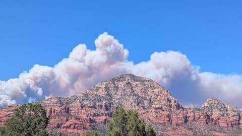 The Pocket Fire, seen from Sedona with Thunder Mountain in the foreground, burns on June 28, 2026.