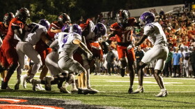 Junior running back Payton Brown drags a crowd of Central Arkansas defenders into the end-zone for a touchdown, Saturday, Sept. 19, 2026.