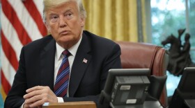 President Donald Trump speaks on the telephone via speakerphone with Mexican President Enrique Pena Nieto in the Oval Office of the White House on August 27, 2018 in Washington, DC. (Win McNamee/Getty Images)