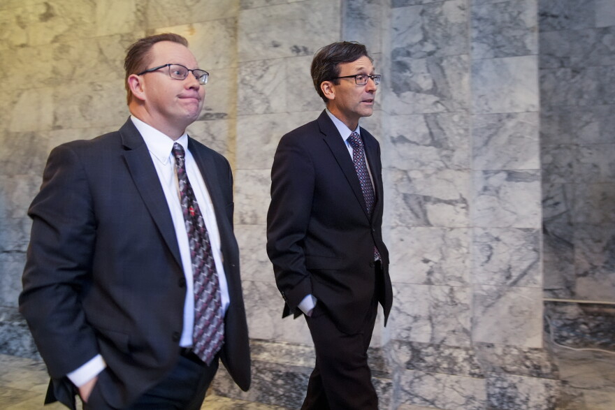 Superintendent of Public Instruction Chris Reykdal walks with former Attorney General Bob Ferguson.