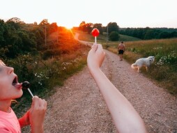 Our family on one our summer evening walks after dinner down our dirt road here in the Ozarks of St. Joe, Arkansas on June 4, 2021. My two kids were enjoying their dessert from dinner, a couple of suckers that our neighbor keeps them in constant supply of. 'An Ozark Childhood' has become a long term project of mine as I tell the stories of my family and community over a period of 10 years.