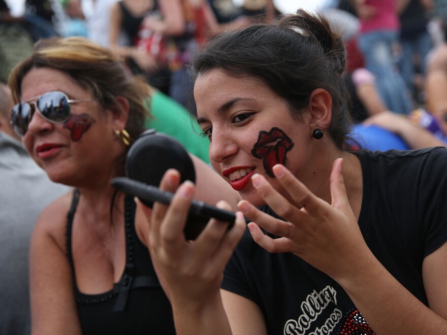 Rolling Stones fans wait for the start of Friday's free concert.