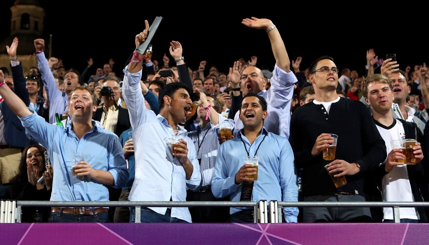 Fans make some noise as they watch Olympic women's beach volleyball at Horse Guards Parade in London. There seems to be little consistency in which sports require quiet from spectators.