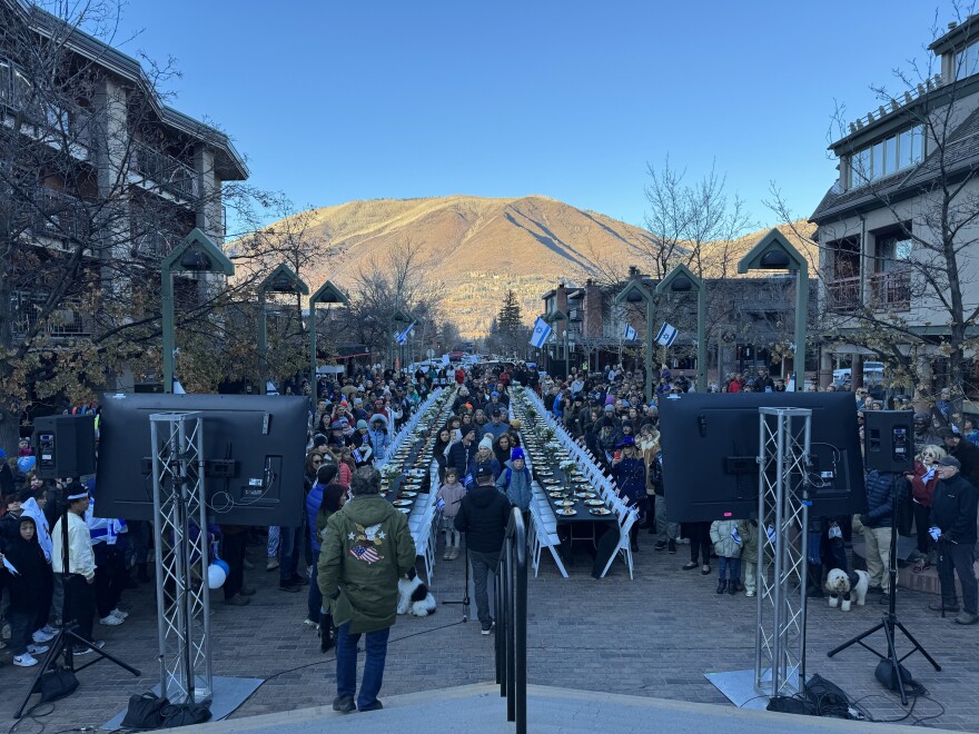 A large crowd of supporters came to an event held in support of Israel at the Gondola Plaza in downtown Aspen as the sun sets. A small group also showed up in support of a ceasefire in the region as well, in recognition of thousands of Palestinian and Israeli casualties.