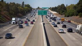 Cars drive on Highway 50 in Sacramento.