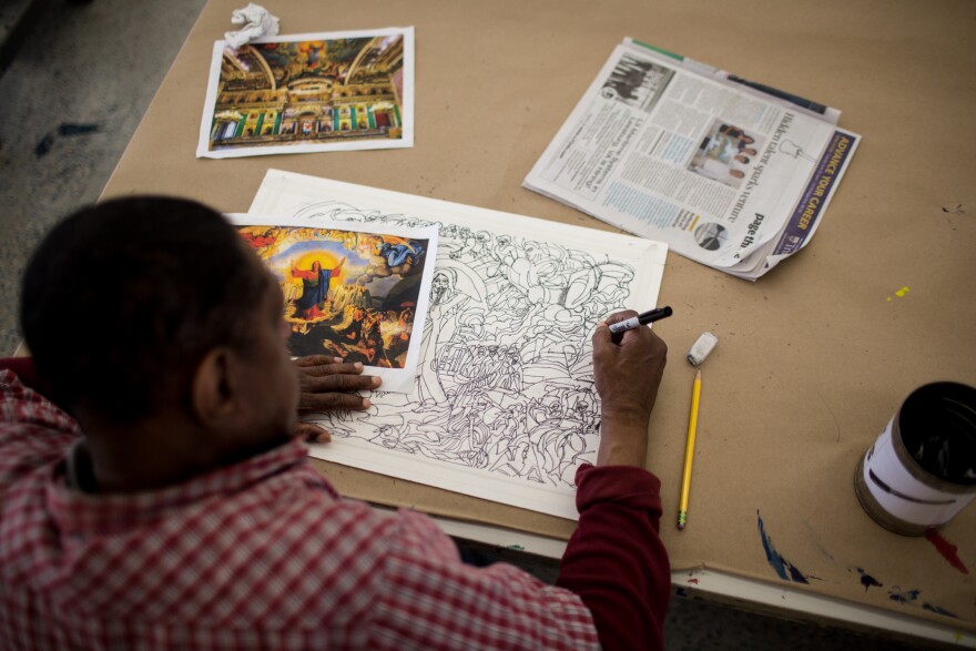 Inspired by an image of Jesus Christ's Last Judgment, artist Raymond Lewis creates a detailed ink drawing in the Art Enables studio.