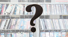 Long shelves of VHS tapes with a question mark in the foreground