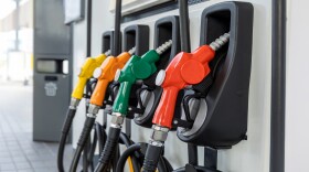 Fuel Pump, Gas Station, Gasoline.Colorful Petrol pump filling nozzles on white background , Gas station in a service in warm sunset.Head fuel vehicle refueling facility in Asia