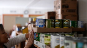 In this file photo, Volunteer Cathy Mileham sorts food at the Long Beach Community Food Pantry 