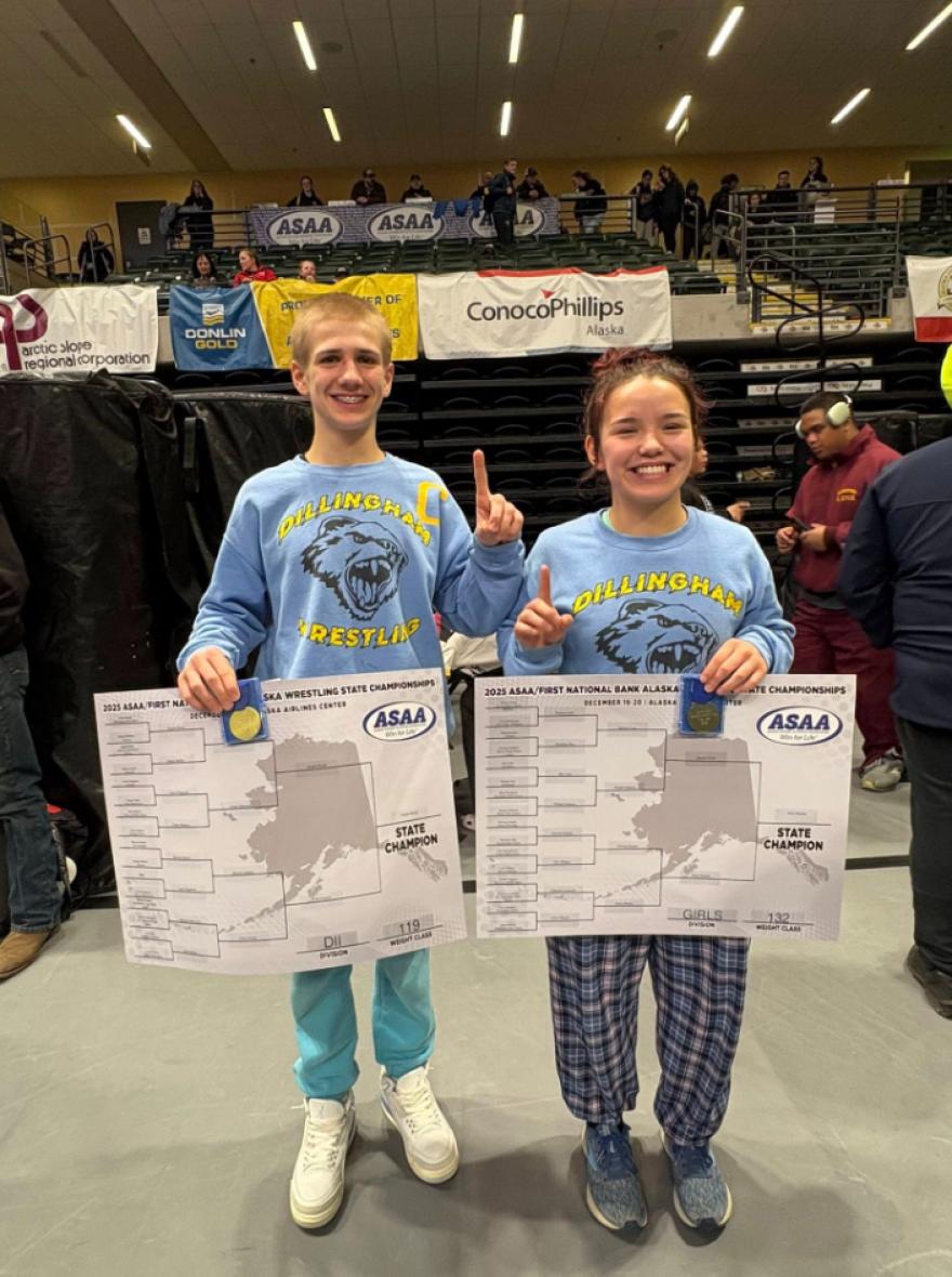 Alora Wassily (right) and August Reigh (left) holding their championship brackets.