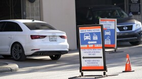 Cars enter and leave a drive-thru voting site in Houston on Election Day in 2020. Texas Republican lawmakers are looking to ban the practice.
