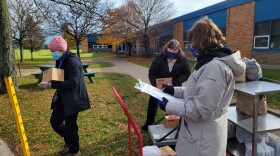 Erie County Department of Senior Services staff hand out frozen meals to older adults Nov. 15, 2021 at the Town of Tonawanda Senior Center.